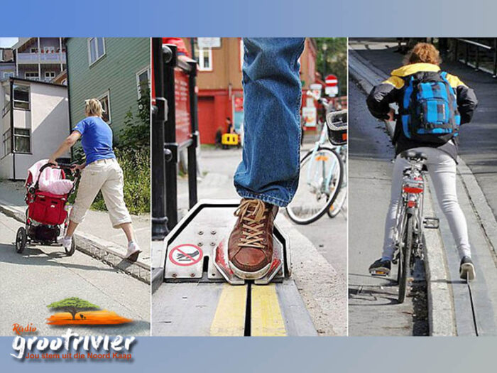 Kind wat 'n fietsroltrap in Noorweë gebruik om 'n heuwel op te klim